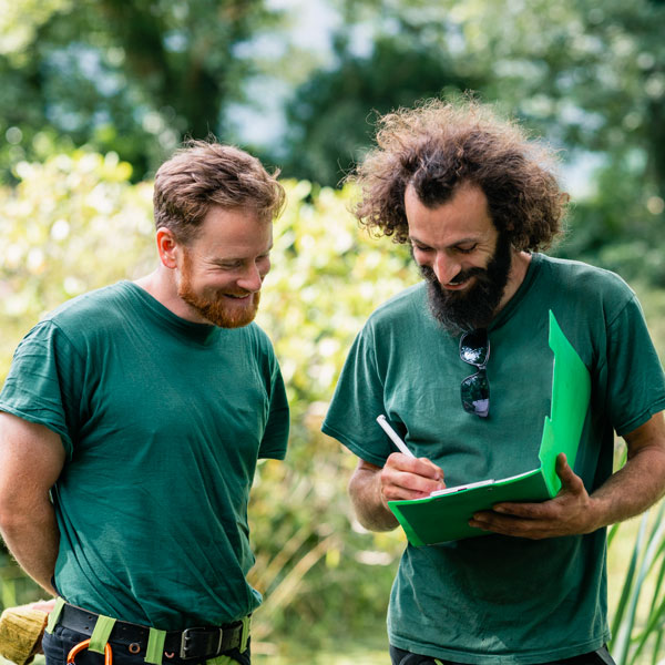 Eastern Grounds Landscaping Team Looking at Plans